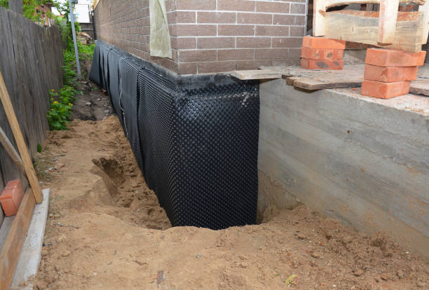SJ Waterproofing Pros technician performing targeted Basement Waterproofing assessment in Grammer, IN